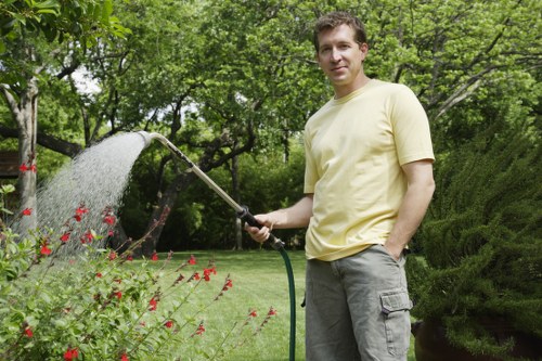 Kenley gardener wearing PPE while completing outdoor maintenance